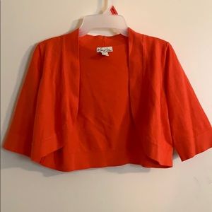peach-orange cardigan